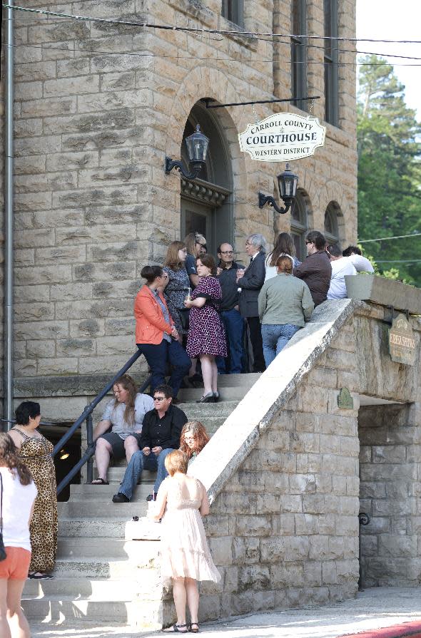 A line of same-sex couples waiting to apply for a marriage license forms at the Carroll County Courthouse Saturday, May 10, 2014, in Eureka Springs, Ark. A judge overturned amendment 83, Friday, which banned same-sex marriage in the state of Arkansas. (AP Photo/Sarah Bentham)