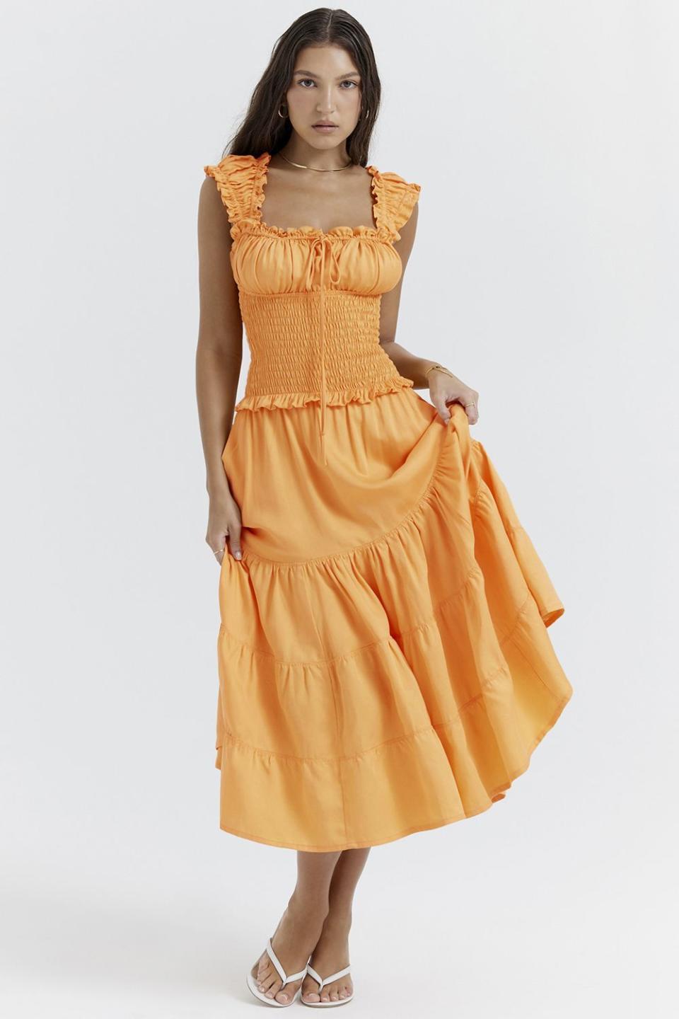 <p><a href="https://www.houseofcb.com/phedra-apricot-shirred-sundress-us.html" rel="nofollow noopener" target="_blank" data-ylk="slk:Shop Now;elm:context_link;itc:0;sec:content-canvas" class="link ">Shop Now</a></p><p>Phedra Tangerine Shirred Sundress</p><p>$225.00</p>