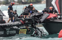 <p>In this photo provided by America’s Cup Event Authority, the crew of Emirates Team New Zealand pickup debris after their boat was righted after capsizing during an America’s Cup challenger semifinal against Great Britain’s Land Rover BAR on the Great Sound in Bermuda on Tuesday, June 6, 2017. (Ricardo Pinto/ACEA via AP) </p>