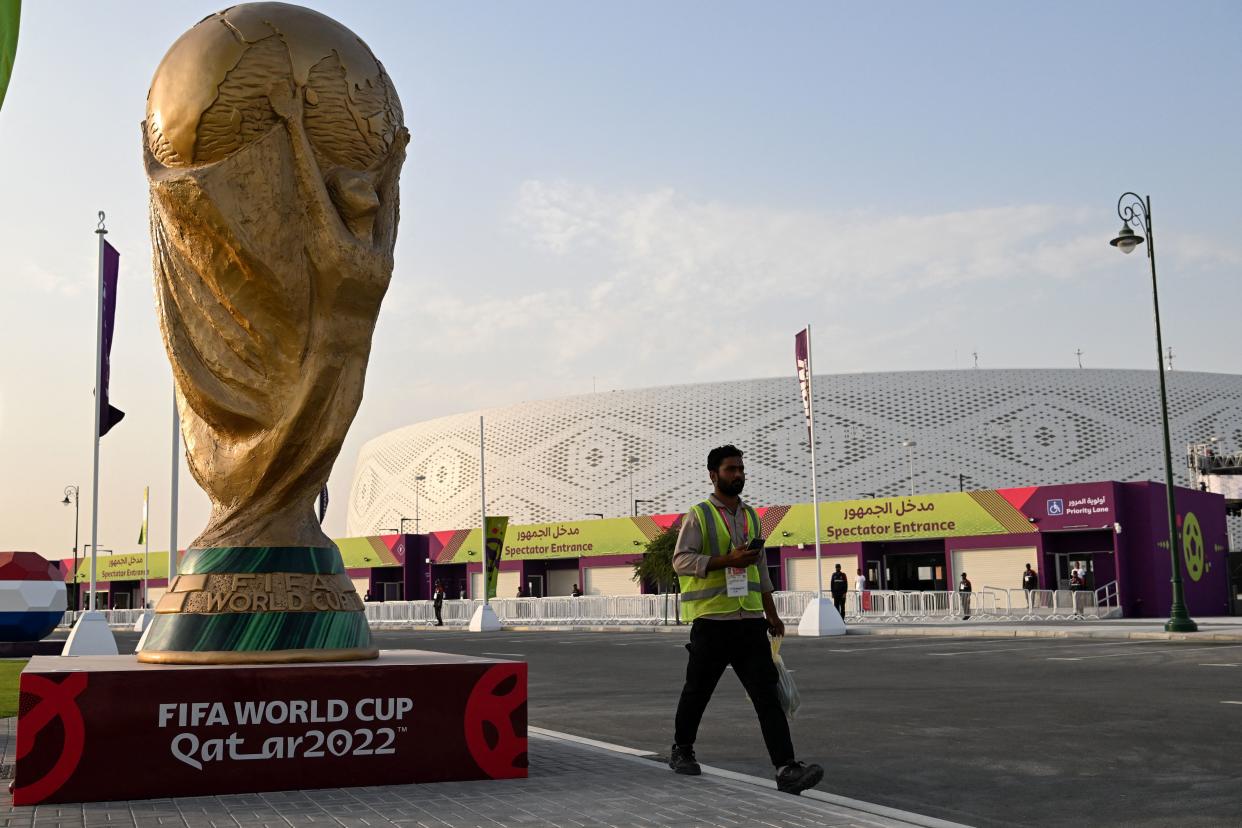 A man walks outside the Al-Thumama Stadium in Doha on November 8, 2022, ahead of the Qatar 2022 FIFA World Cup football tournament. (Photo by Kirill KUDRYAVTSEV / AFP) (Photo by KIRILL KUDRYAVTSEV/AFP via Getty Images)