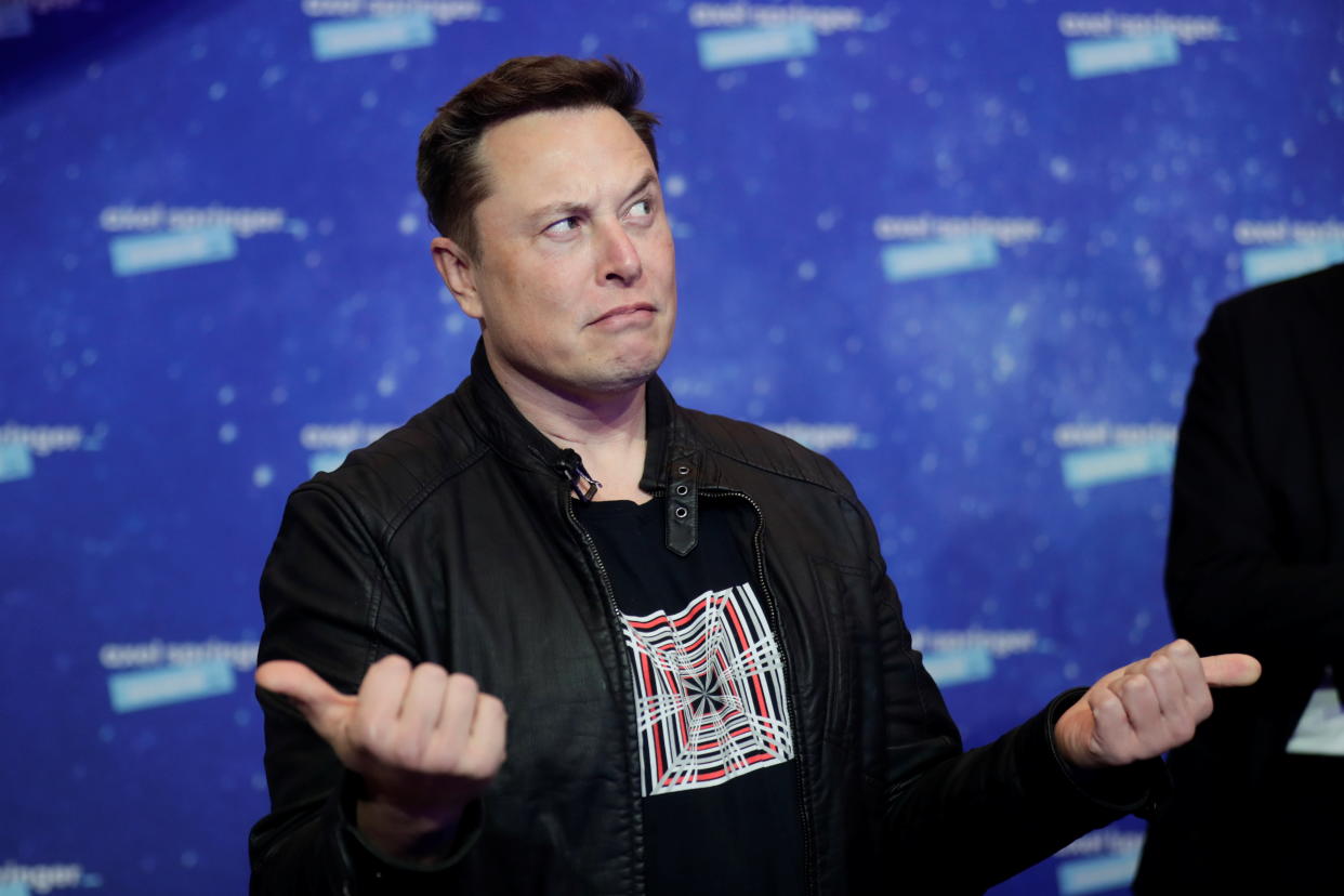 SpaceX owner and Tesla CEO Elon Musk grimaces after arriving on the red carpet for the Axel Springer award, in Berlin, Germany, December 1, 2020. REUTERS/Hannibal Hanschke/Pool