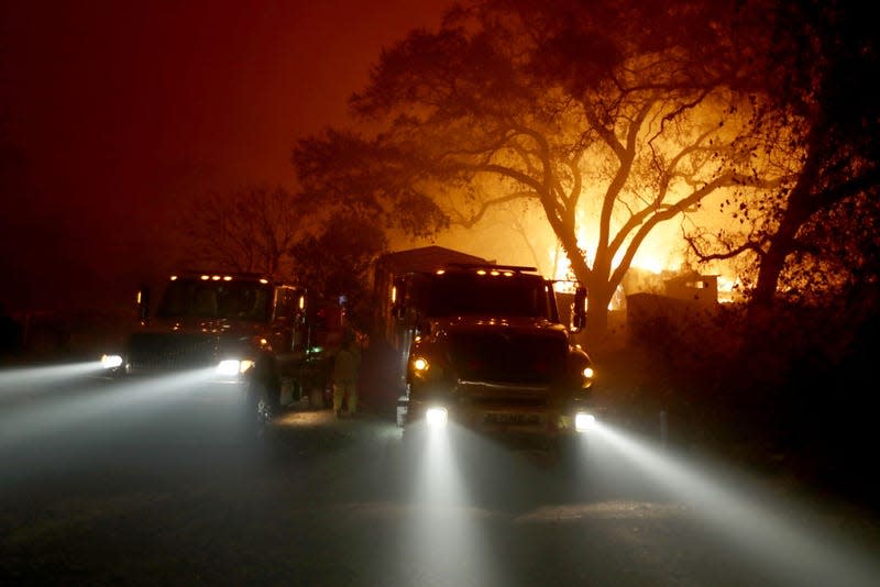 West Sacramento firefighters battle the Camp Fire on Honey Run Road in Paradise, California, on November 9, 2018.