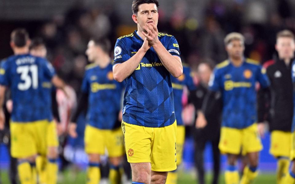 Manchester United's English defender Harry Maguire applauds the fans following the English Premier League football match between Brentford and Manchester United - AFP