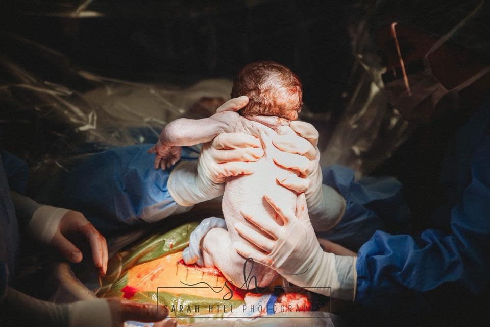 Midwife Emily Dial wanted to deliver her baby herself (Sarah Hill Photography)