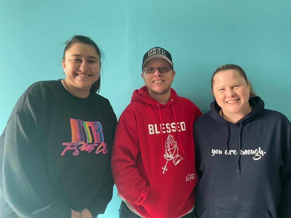 Amanda Guzma, left, Jace Pennington, middle, and Beth Pennington, right, at No Tie Required T-Shirt Co. on March 21, 2023.