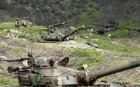 Servicemen of the self-defense army of Nagorno-Karabakh rest at their positions near the village of Mataghis April 6, 2016. REUTERS/Staff