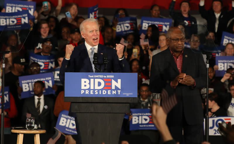 Democratic U.S. presidential candidate and former Vice President Biden speaks as Rep. James Clyburn (D-SC) looks on, at his South Carolina primary night rally in Columbia