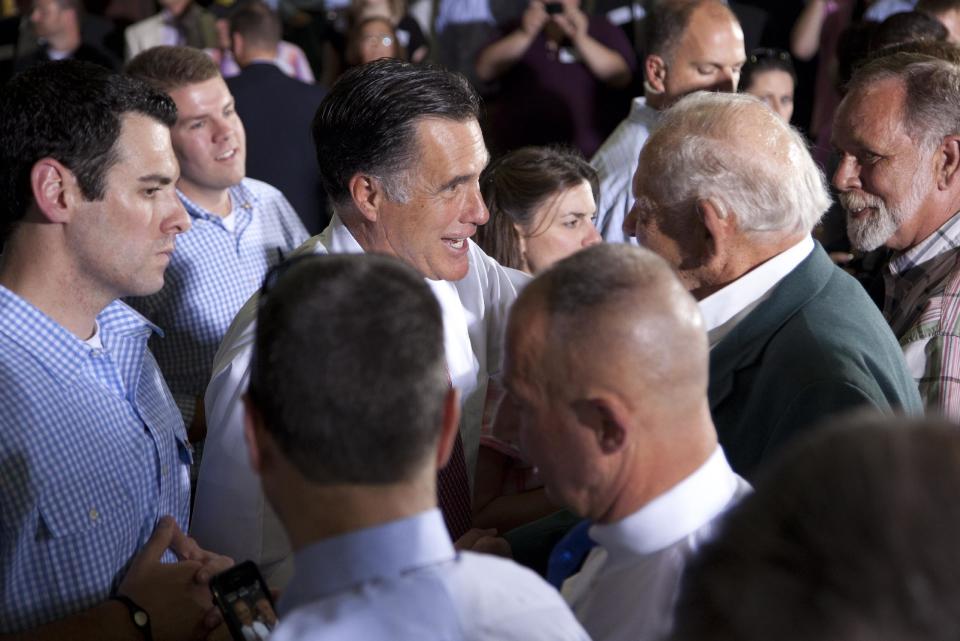 Republican presidential candidate, former Massachusetts Gov. Mitt Romney shakes hands during a campaign stop at Seilkop Industries in Cincinnati, Ohio, Thursday, June 14, 2012. (AP Photo/Evan Vucci)