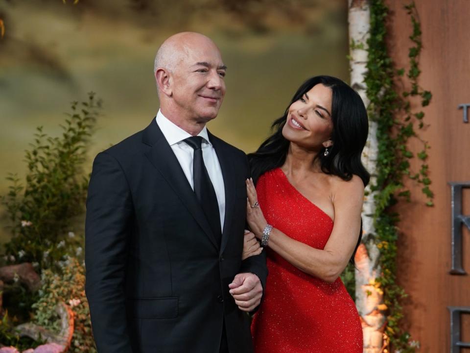 Jeff Bezos and his wife, Lauren Sanchez (PA)