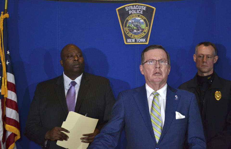 Syracuse Police Chief Kenton T. Buckner, left, Onondaga County District Attorney William J. Fitzpatrick, center, and Syracuse Police Lt. David Brown, right, attend a news conference at the Syracuse Police Department in Syracuse, N.Y., Thursday, Feb. 21, 2019, about Syracuse men's NCAA college basketball head coach Jim Boeheim's involvement in a fatal car accident where he struck and killed a man standing along an interstate in Syracuse. Boeheim struck and killed a man along an interstate late Wednesday night as he tried to avoid hitting the man's disabled vehicle, police say. (AP Photo/Nick Lisi)