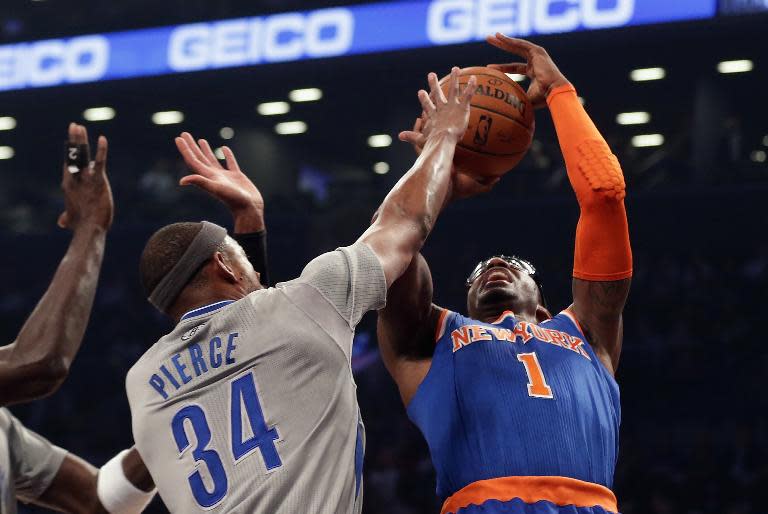 Paul Pierce of the Brooklyn Nets stops a shot by New York Knicks' Amare Stoudemire at the Barclays Center on April 15, 2014