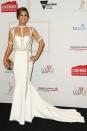 <p>Amber Sherlock left the jacket at home and brought her glamour A-game in this white and gold Jason Grech gown.</p>