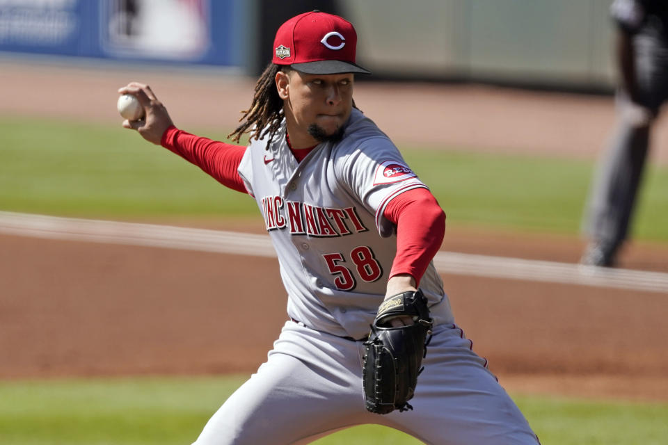 Cincinnati Reds starting pitcher Luis Castillo throws during the first inning in Game 2 of a National League wild-card baseball series, Thursday, Oct. 1, 2020, in Atlanta. (AP Photo/John Bazemore)