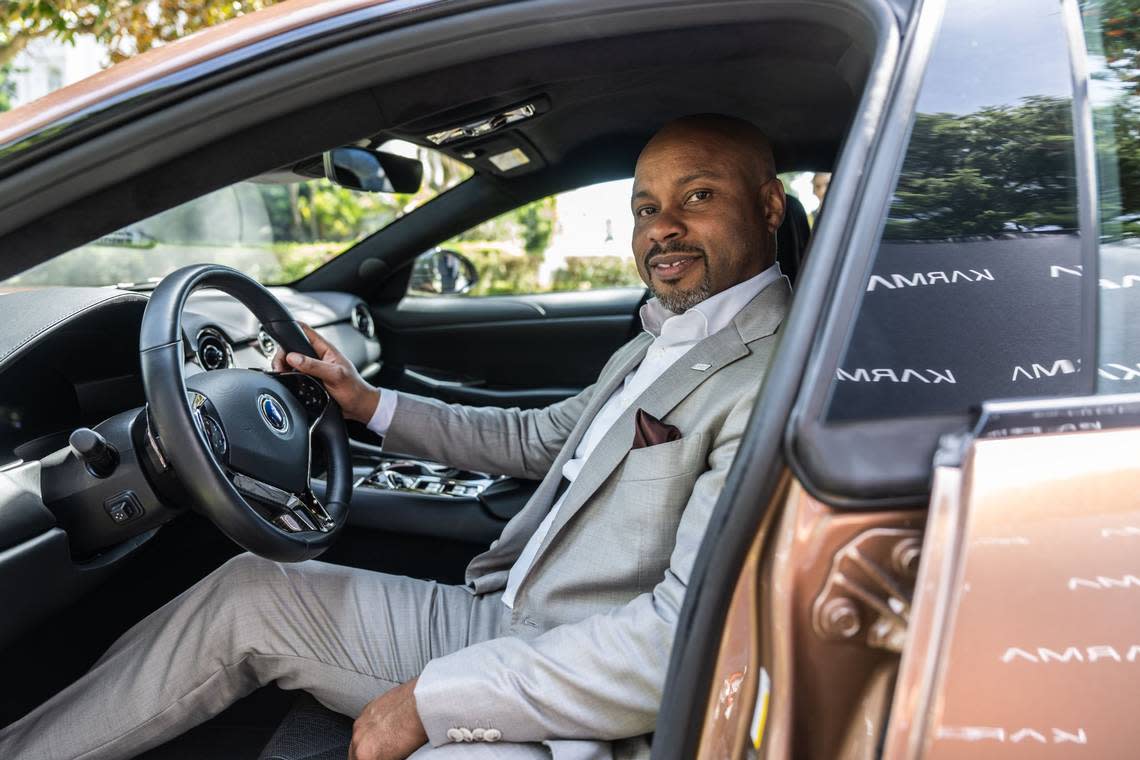 Karma CEO Marques McCammon sits on the driver’s seat on Wednesday of his company’s Karma Revero, a range-extended luxury electric vehicle manufactured in Southern California. Hector Amezcua/hamezcua@sacbee.com