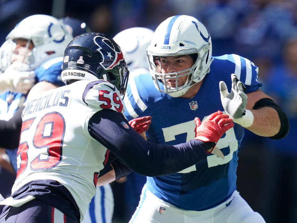 Eric Fisher holds a block against the Houston Texans.