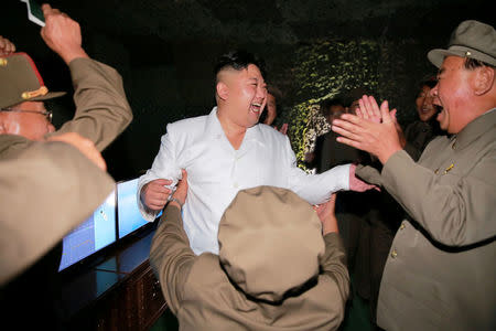 FILE PHOTO : North Korean leader Kim Jong Un reacts as he inspects a test-fire of strategic submarine-launched ballistic missile with Ri Pyong Chol (R) in this undated photo released by North Korea's Korean Central News Agency (KCNA) in Pyongyang August 25, 2016. REUTERS/KCNA/File Photo