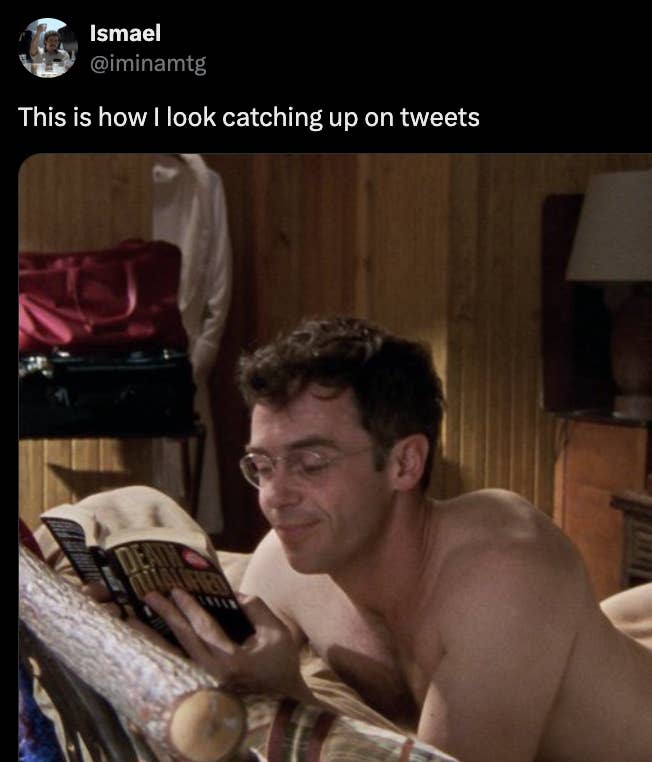 Screenshot from "Sex and the City" of Steve shirtless and reading in bed