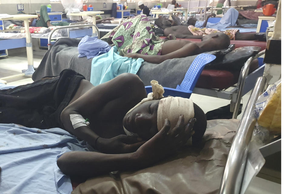 Injured victims of a suicide bomb attack receive treatment at a hospital in Maiduguri, Nigeria, Sunday, June 30, 2024. At least 18 people were killed and 30 injured, including 19 seriously, in coordinated attacks by suspected female suicide bombers in Nigeria's northeastern city of Gwoza on Saturday, local authorities said, raising security concerns in a region which has been at a center of Islamist insurgency. (AP Photo/Joshua Omiri)