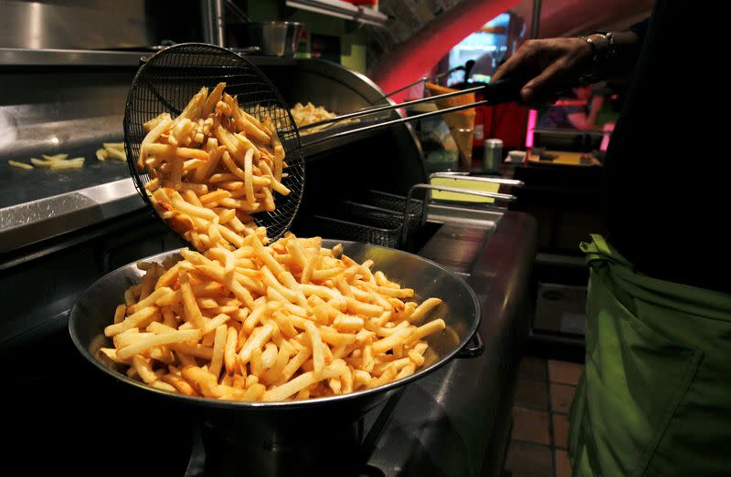 FILE PHOTO: A cook prepares fries in a cafe at the Frietmuseum in Bruges