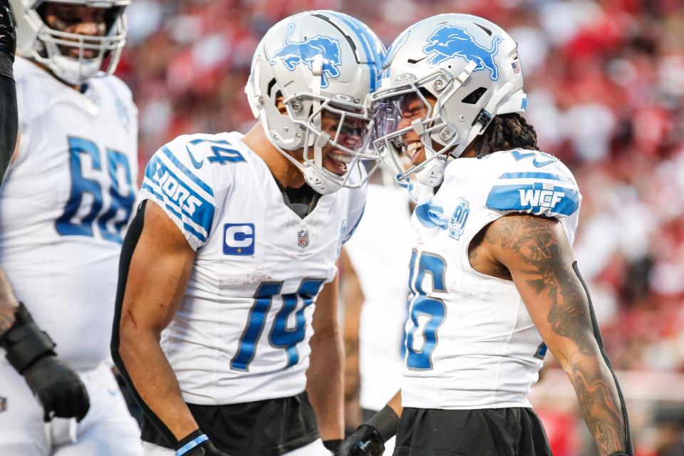 Lions running back Jahmyr Gibbs, right, celebrates a touchdown with wide receiver Amon-Ra St. Brown during the first half of the NFC championship game at Levi's Stadium in Santa Clara, California, on Sunday, Jan. 28, 2024.