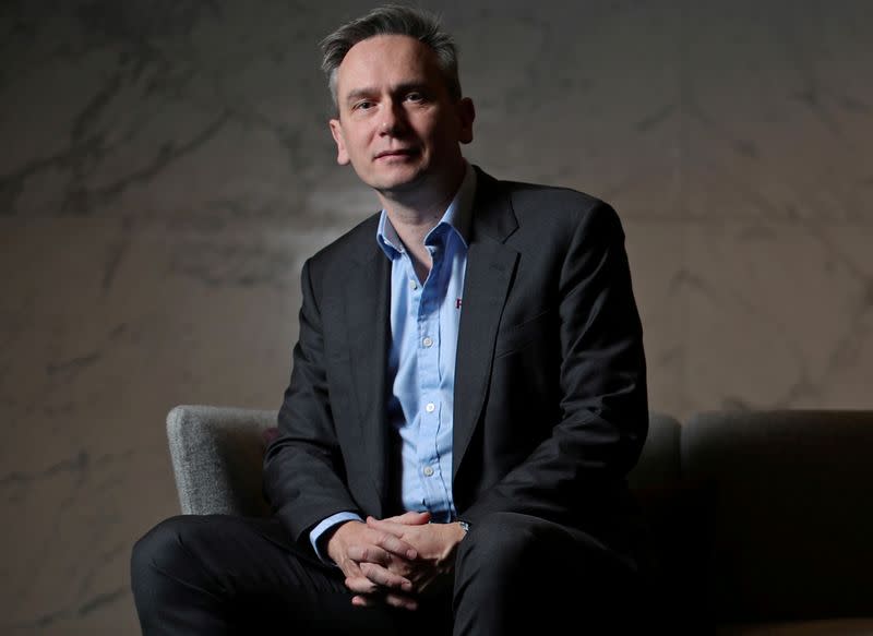 FILE PHOTO: Jean-Sebastien Jacques, CEO of Rio Tinto Group poses for a portrait ahead of the publication of the company 2019 full year results in London