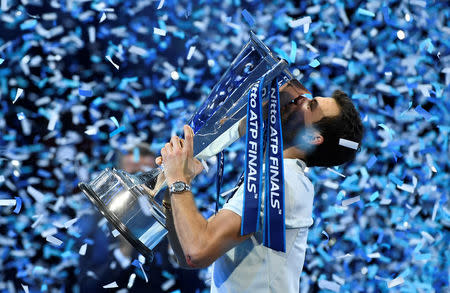 Tennis - ATP World Tour Finals - The O2 Arena, London, Britain - November 19, 2017 Bulgaria's Grigor Dimitrov celebrates with the trophy after winning the final against Belgium's David Goffin Action Images via Reuters/Tony O'Brien
