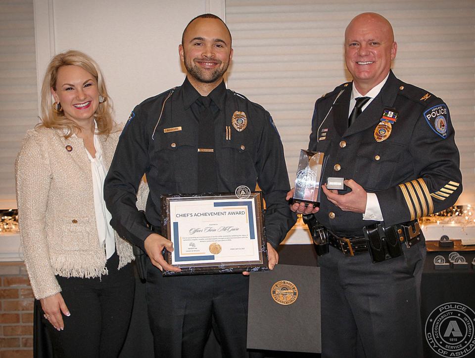 2022 Chief's Achievement Award L to R; State Rep. Melanie Miller, Officer Tevin McGuire, Chief David Lay
