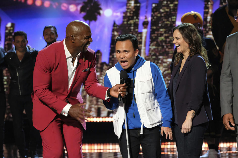 This Wednesday, Aug. 14, 2019 photo provided by NBC shows host Terry Crews, left, and singer Kodi Lee on the NBC television show, "America's Got Talent," in Los Angeles. With the top two most-watched television shows last week, NBC's "America's Got Talent'" continues its dominance when the heat is on. It's the summer's most-watched television series for six summers in a row. (Justin Lubin/NBC via AP)