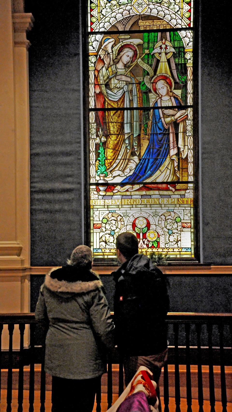 These visitors checked out the stained glass window display at St. Mary of the Immaculate Conception.