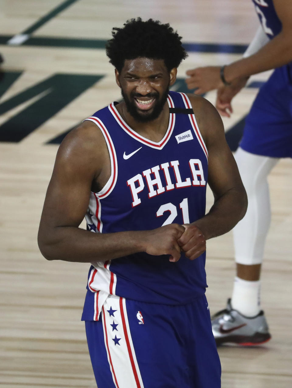 Philadelphia 76ers center Joel Embiid (21) reacts during the second half against the Boston Celtics in Game 3 of an NBA basketball first-round playoff series, Friday, Aug. 21, 2020, in Lake Buena Vista, Fla. (Kim Klement/Pool Photo via AP)