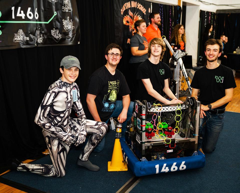 Robot 1466 came to the Children’s Museum Gala with Webb School of Knoxville robotics team members who designed and built it. From left, they are Pete Clark, in an Avatar costume for the Gala, James Overall, Charlie McDowell and Nicholas Kurzak.