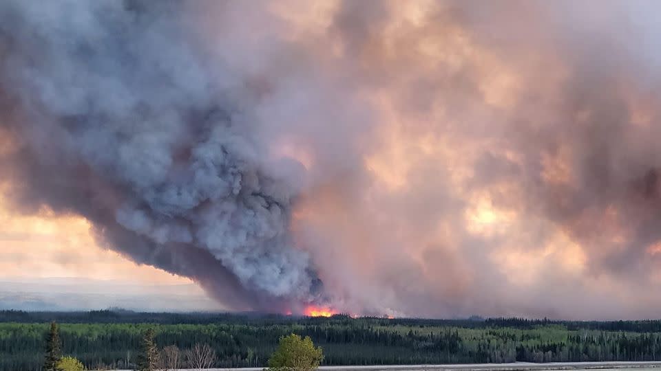 Smoke rises from a wildfire burning near Fort Nelson on May 14. - Cheyenne Berreault/Anadolu/Getty Images