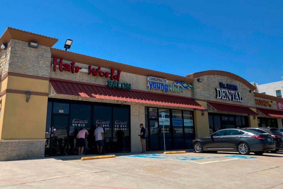 This photo shows the exterior of Hair World Salon in Dallas on Thursday, May 12, 2022. Police searched Thursday for a man who opened fire inside the hair salon in Dallas’ Koreatown area, wounding three people. Authorities do not yet know why the man shot the three female victims Wednesday afternoon at Hair World Salon, which is in a shopping center with many businesses owned by Korean Americans. (AP Photo by Jamie Stengel)