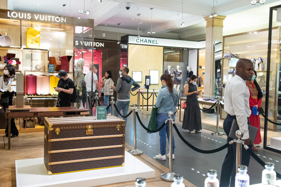 Customers shopping in Harrods store in Knightsbridge, London, as it reopens its doors on Monday.