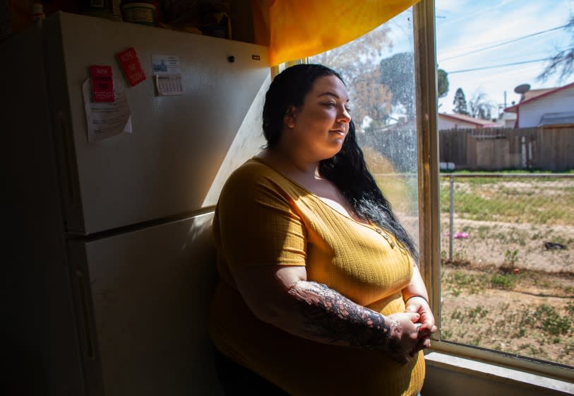Bakersfield, CA., March 4, 2020 - Jenny Morones, 26, of Bakersfield poses for a portrait on Wednesday, March 4, 2020 in Bakersfield, California. Morones is working mother struggling to raise three children on a low income. Morones fled an abusive relationship and though in her twenties, has dealt with health challenges.Thanks to the Affordable Care Act, Morones had health insurance that protected her from financial ruin. (Jason Armond / Los Angeles Times)