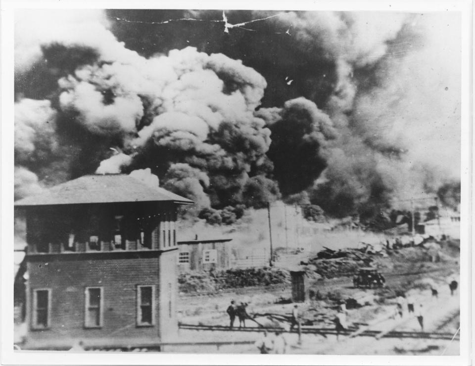 Smoke rises north of Greenwood Avenue from Hartford Avenue, in Tulsa, Okla. on June 1, 1921.