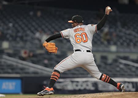 Mar 31, 2019; Bronx, NY, USA; Baltimore Orioles relief pitcher Mychal Givens (60) delivers a pitch during the seventh inning against the New York Yankees at Yankee Stadium. Mandatory Credit: Vincent Carchietta-USA TODAY Sports