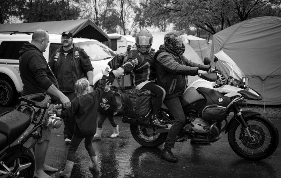 CMA members say goodbye to a family as they start their 700km ride back home after their annual rally (EPA)