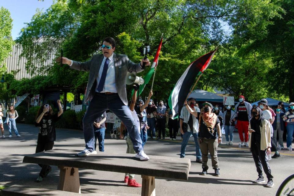 A counter-protester antagonizes pro-Palestinian activists on Tuesday, April 30, 2024, outside their tent encampment at Sacramento State. The protesters are asking the university to divest from investments in Israel. Jose Luis Villegas/jvillegas@sacbee.com