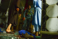 <p>An Afghan security personel inspects the site of a suicide bomb attack at a Shiite mosque in Herat on August 1, 2017. (Photo: Hoshang Hashimi/AFP/Getty Images) </p>