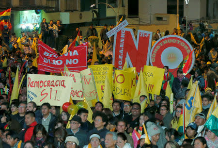 Demonstrators participate in a protest rally against Bolivian President Evo Morales' bid for re-election in 2019, in La Paz, Bolivia October 10, 2017. Signs read: "Bolivia says no, Democracy yes". REUTERS/David Mercado