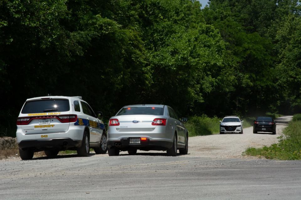 Henderson, Kentucky, law enforcement vehicles traversing Sunset Lane Wednesday, May 24, 2023, as they search for escaped Ohio inmate Bradley Gillespie.