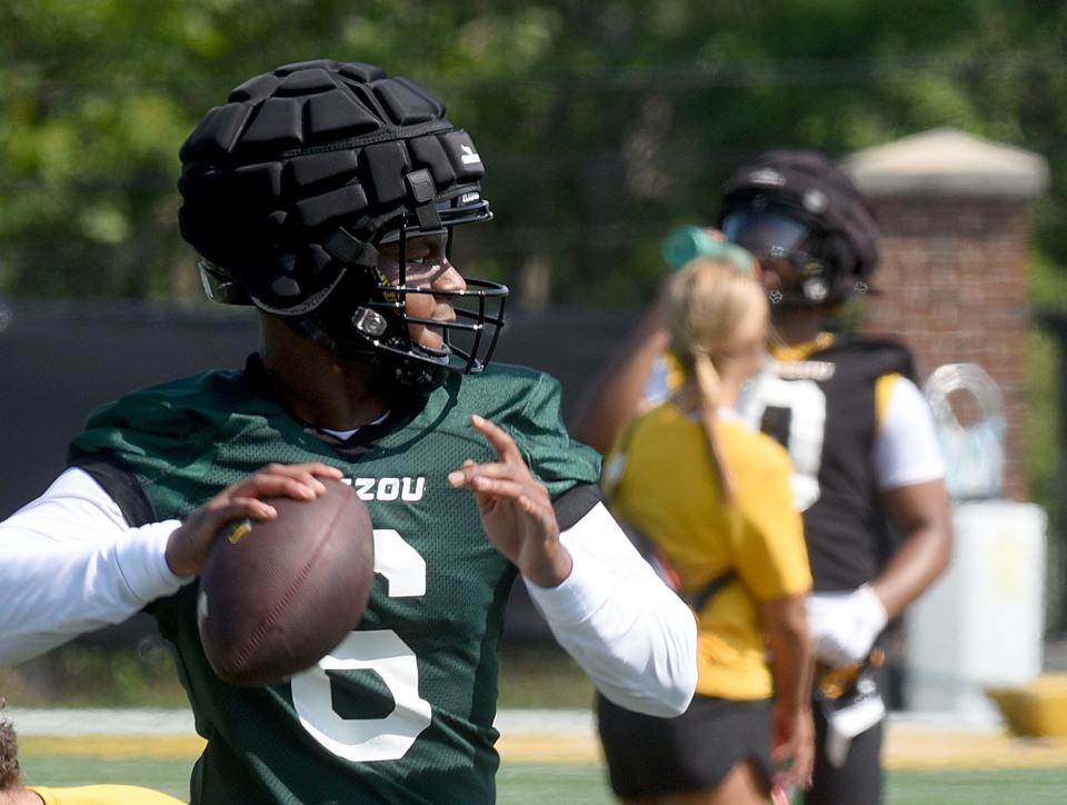 Missouri quarterback Tyler Macon prepares to throw a pass during the first practice of the season Monday at the Kadlec Practice Fields.