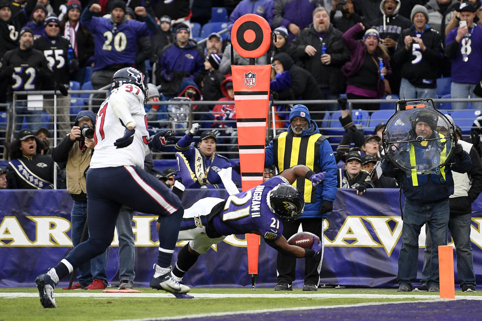 Baltimore Ravens running back Mark Ingram (21) dives in for a touchdown on a pass from quarterback Lamar Jackson, not visible, during the second half of an NFL football game against the Houston Texans, Sunday, Nov. 17, 2019, in Baltimore. (AP Photo/Nick Wass)