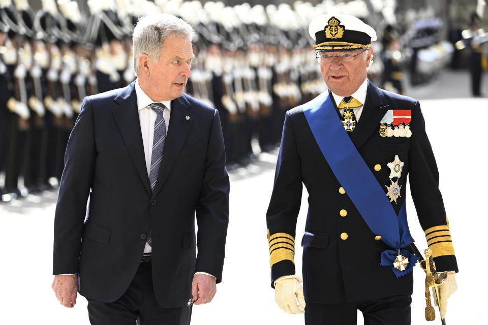 Finland's President Sauli Niinistö, left, and Sweden's King Carl Gustaf walk in the Royal Courtyard in Stockholm Tuesday 17 May. Finland's President Sauli Niinistö and his wife Jenni Haukio will pay a two day long State Visit to Sweden at the invitation of His Majesty The King Carl Gustaf. (Anders Wiklund/TT News Agency via AP)