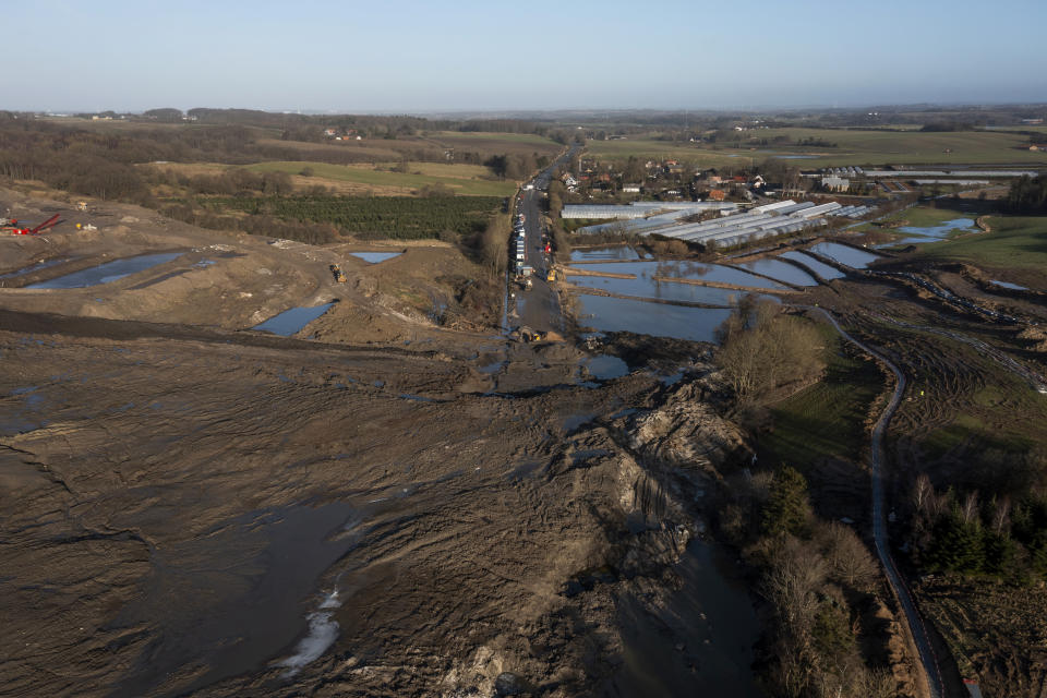 The area affected by a landslide of several million tonnes contaminated soil is pictured, near the village of Oelst, near Randers, Denmark, Thursday Jan. 25, 2024. On Monday, Prime Minister Mette Frederiksen said that "of course, it would be totally unfair if the children in Randers or elderly have to pay this bill,” after visiting the site with a 75-meter (82-yard) tall heap of dirt at the Nordic Waste reprocessing plant site with 3 million cubic meters (3,923,852 cubic yard) of contaminated soil. (Bo Amstrup/Ritzau Scanpix via AP)