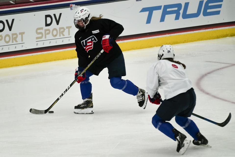 Sydney Morrow and Maggie Scannell practice for the 2022 U.S. U18 Women's World Hockey Championships Saturday, June 11, 2022, in Madison, Wis. Nearly one-third of the players on the U.S. women's hockey team competing in this week’s under-18 World Championships are training at programs outside their home states. (AP Photo/Morry Gash)