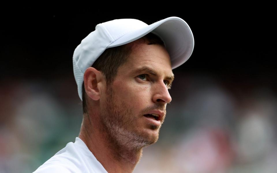 Andy Murray of Great Britain looks on against James Duckworth of Australia in the first round men's singles match during Day One of the 2022 Wimbledon Championships at the All England Lawn Tennis and Croquet Club on June 27, 2022 in London, England.  - GETTY IMAGES