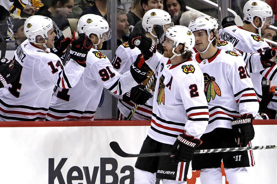 Chicago Blackhawks' Duncan Keith (2) returns to the bench after scoring during the second period of an NHL hockey game against the Pittsburgh Penguins in Pittsburgh, Sunday, Jan. 6, 2019. (AP Photo/Gene J. Puskar)