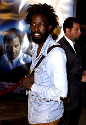 Saul Williams tries not to look at the disapproving visage of Jeff Bridges at the Westwood premiere of K-Pax